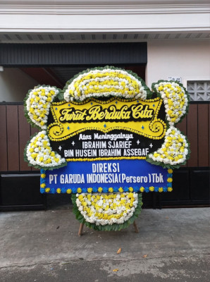 Papan Bunga Duka di Sumber