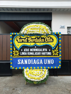 Papan Bunga Duka di Sumber